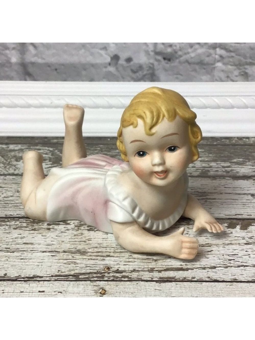 Vintage porcelain piano baby figurine
